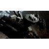 PS4 Armored Core VI Fires of Rubicon CZ bojový mech útočí obří mechanickou paží v průmyslovém komplexu